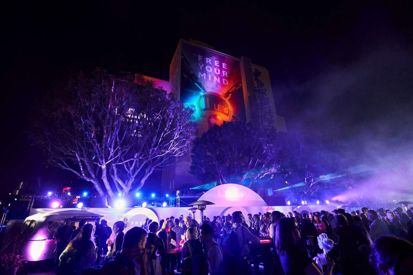 An evening activation beneath the campus billboard